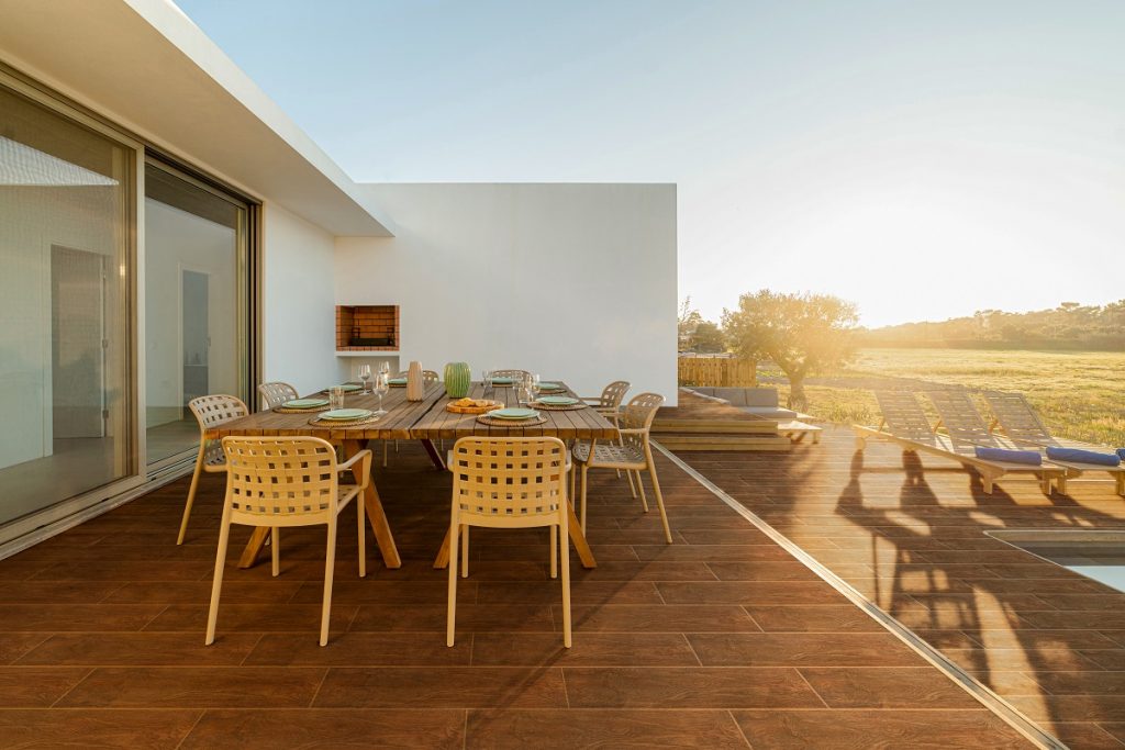 Dinner table setting in modern villa terrace