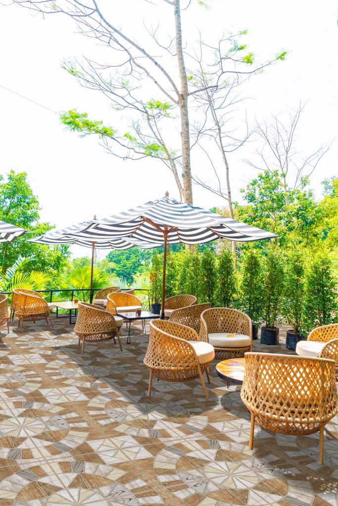 empty outdoor patio table and chair with cushions